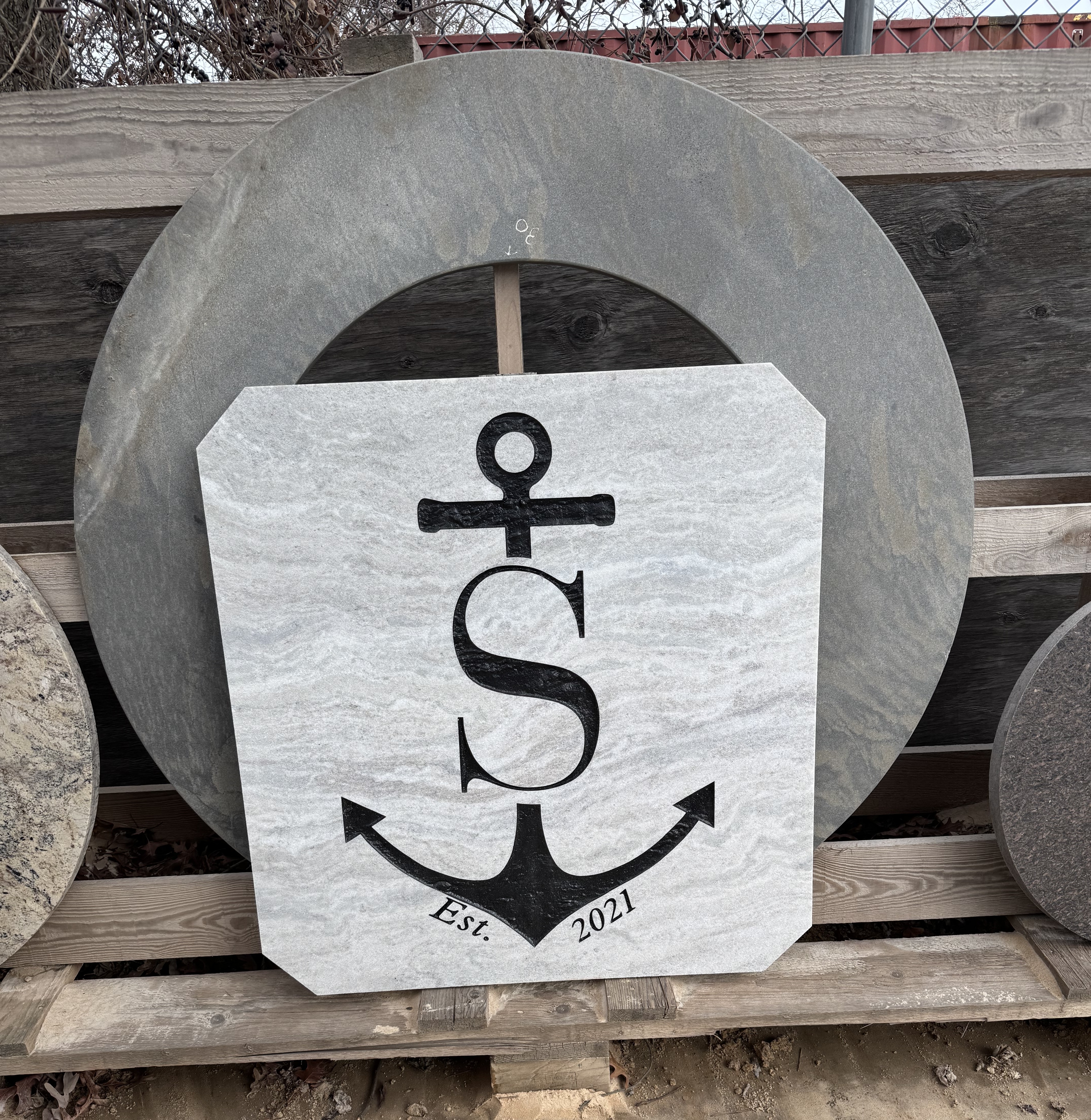 Custom carved granite monogram sign with anchor, reading Est. 2021