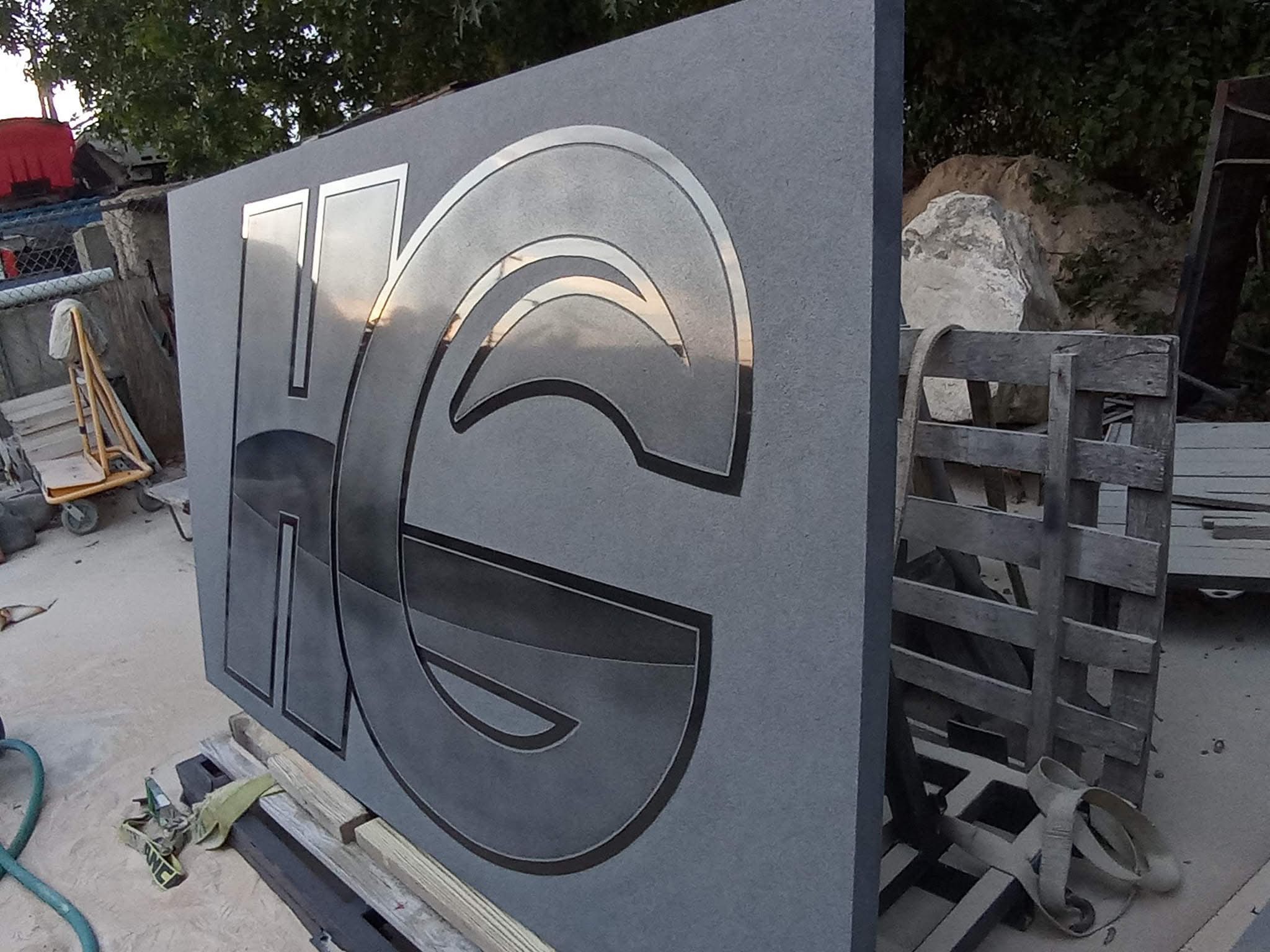 Custom carved HG monogram granite sign