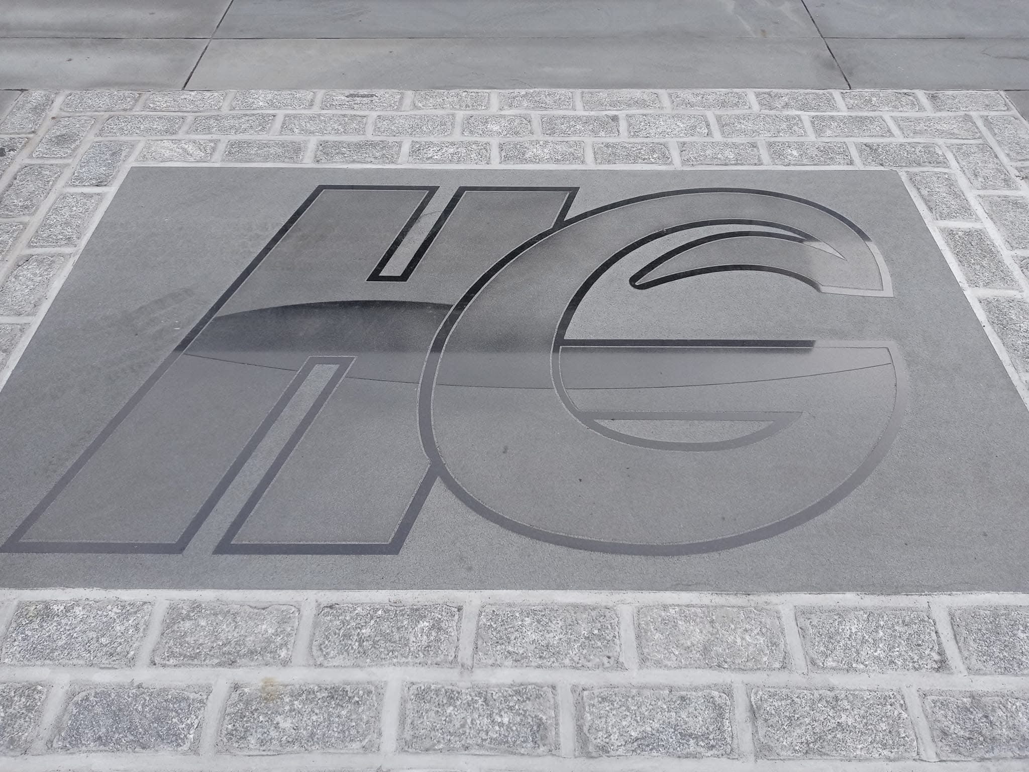 HG monogram engraved into stamped concrete walkway