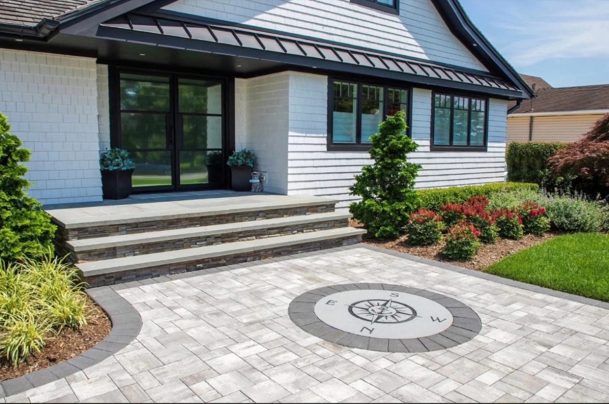Compass rose inlay on a patio beside entry steps