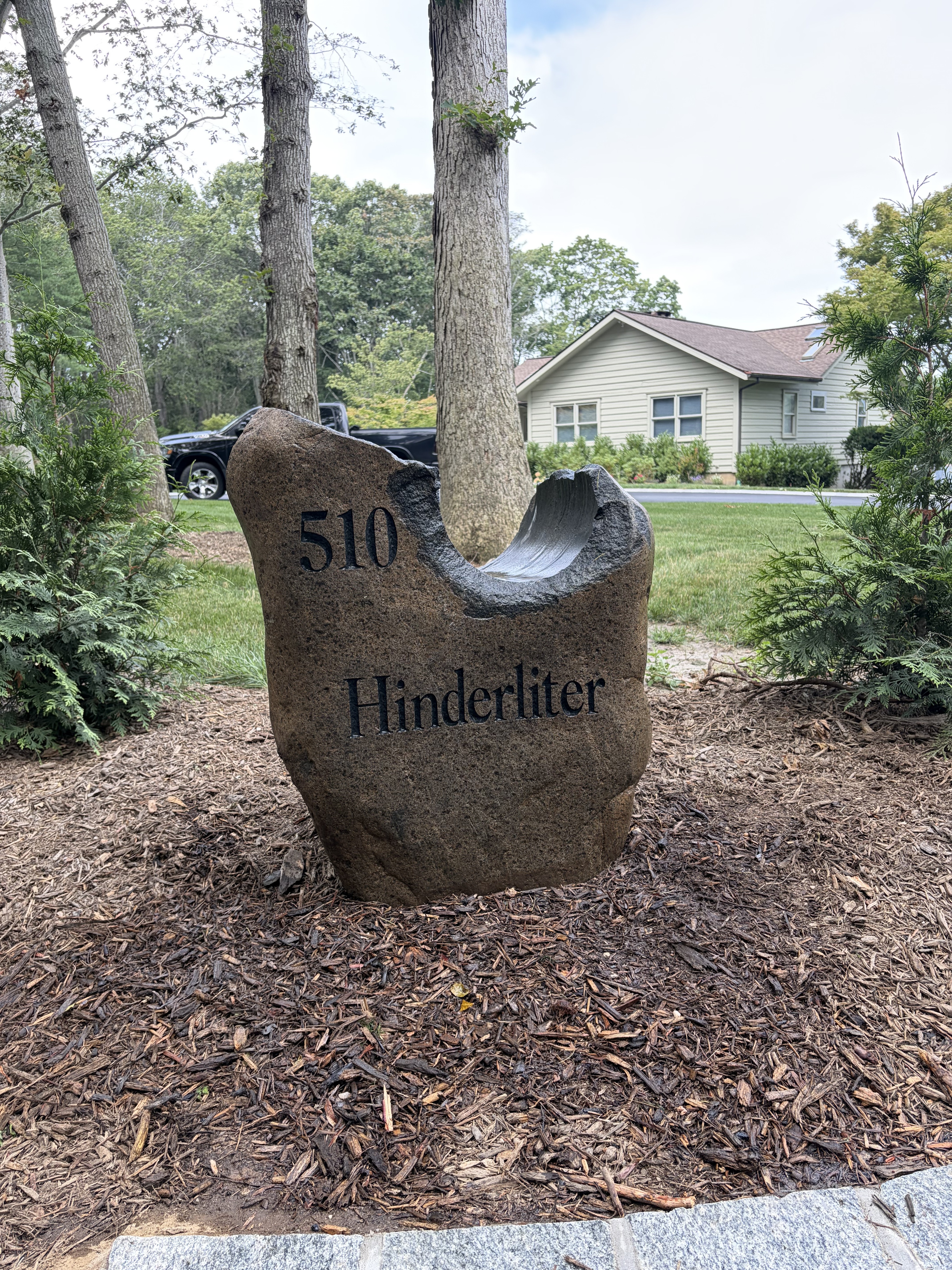 Engraved address rock reading 510 Hinderliter with a carved dish