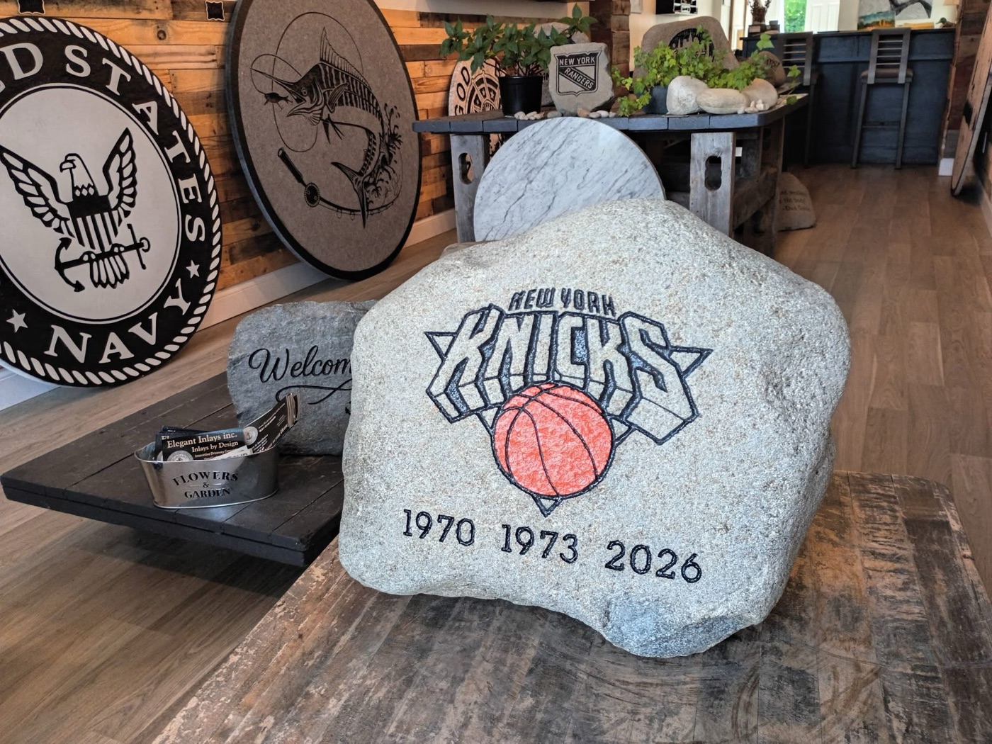 New York Knicks engraved rock with a hand-colored basketball, on display in the Sayville showroom