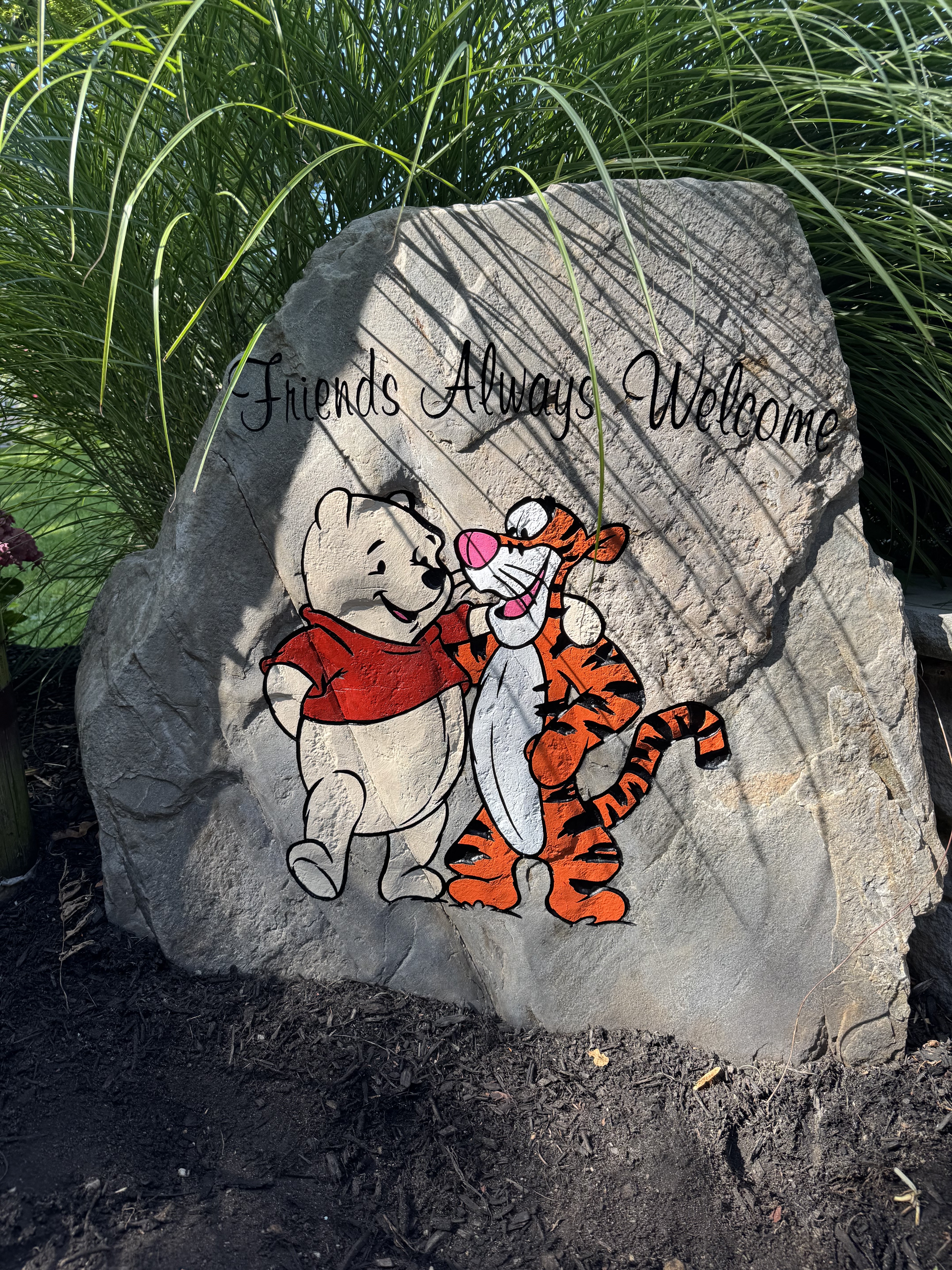 Winnie the Pooh and Tigger painted rock reading Friends Always Welcome